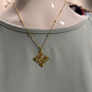 Gold Elegant M Pendant Necklace with Intricate Design